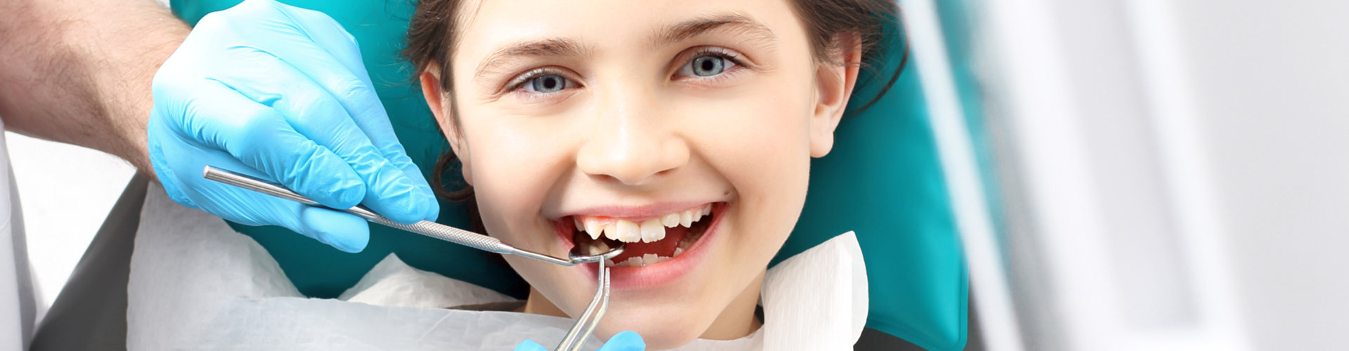 little girl smiling during dental operation